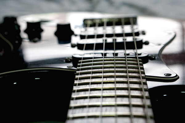Electric guitar, close up on background, Used to play music and notes, For sing a song, macro abstract