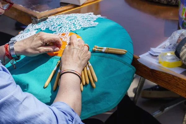 bobbin lace, textile technique, considered as a craft, which consists of interweaving threads that are initially wound on bobbins, called bobbins, to better handle them.