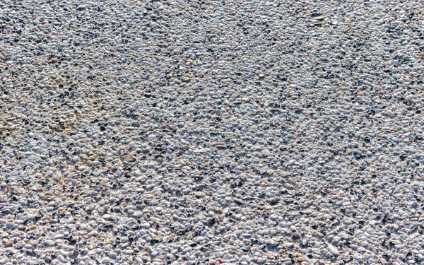 Zementblock Oberflächentextur Hintergrund Mit Verschiedenen Kieselsteinen Aus Nächster Nähe — Stockfoto