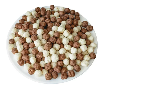 Various cocoa and vanilla flavored cornflakes balls isolated on white background, top view