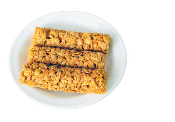 stock image breakfast cereal bars with vitamins in a plate, isolated on a white background