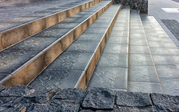 decorated tiled outdoor stairs to the entrance to the building, side view