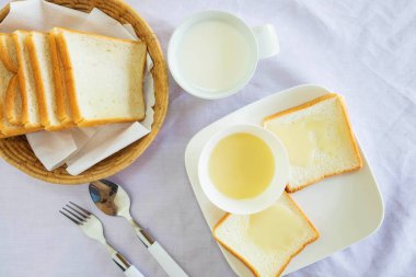 Bread and sweetened condensed milk on the table