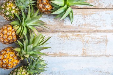 Pineapple fruit on a wooden background