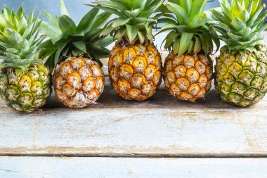 Fresh pineapple fruit on a wooden table