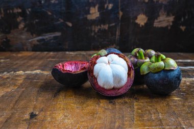 Fresh mangosteen fruit on a wooden table