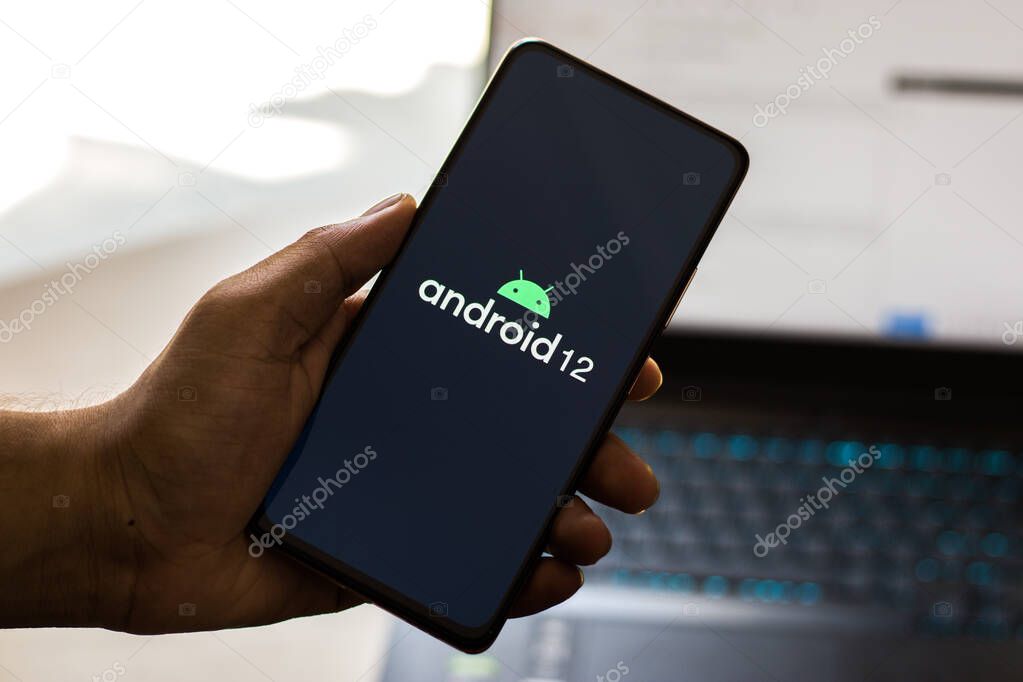 Assam, india - May 19, 2021 : Android 12 logo on phone screen stock image.