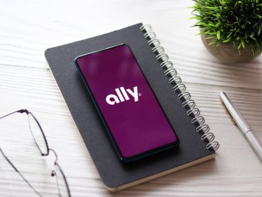 Assam, india - February 19, 2021 : Ally logo on phone screen stock image. clipart