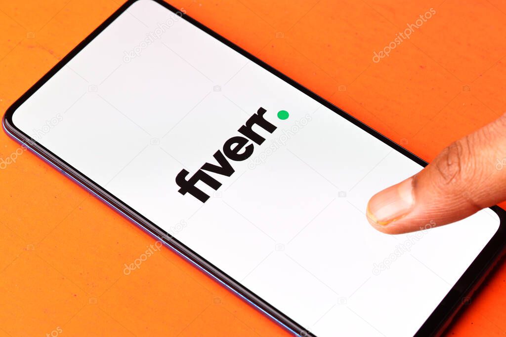 Assam, India - August 6, 2021 : Fiverr logo on phone screen stock image.