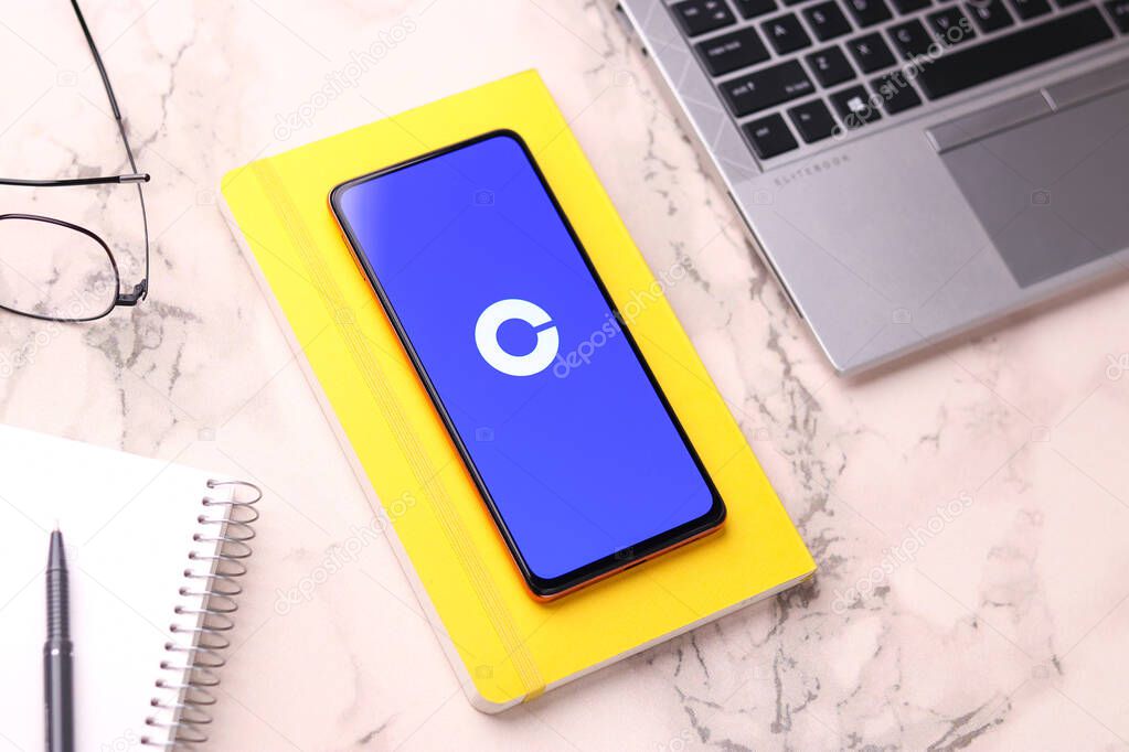 Assam, india - March 10, 2021 : Coinbase logo on phone screen stock image.
