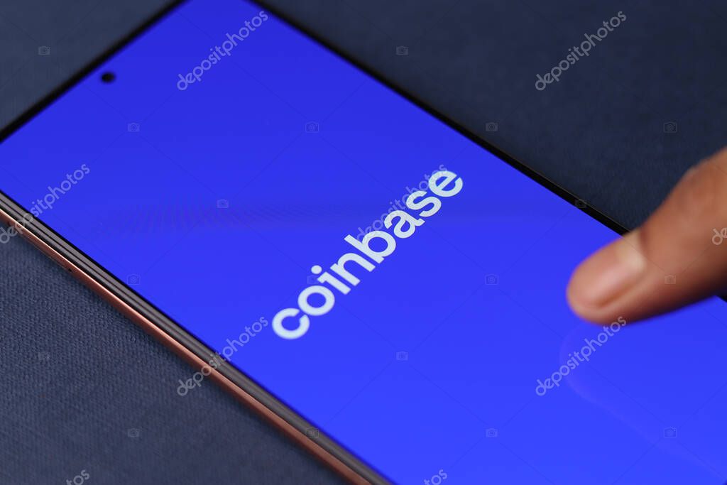 Assam, india - March 10, 2021 : Coinbase logo on phone screen stock image.