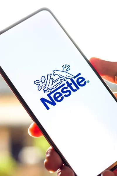 stock image West Bangal, India - October 09, 2021 : Nestle logo on phone screen stock image.