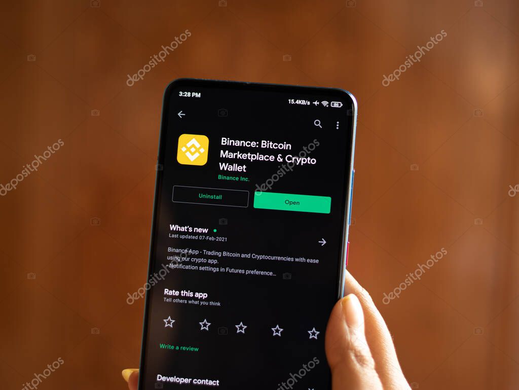 Assam, india - March 10, 2021 : Binance logo on phone screen stock image.