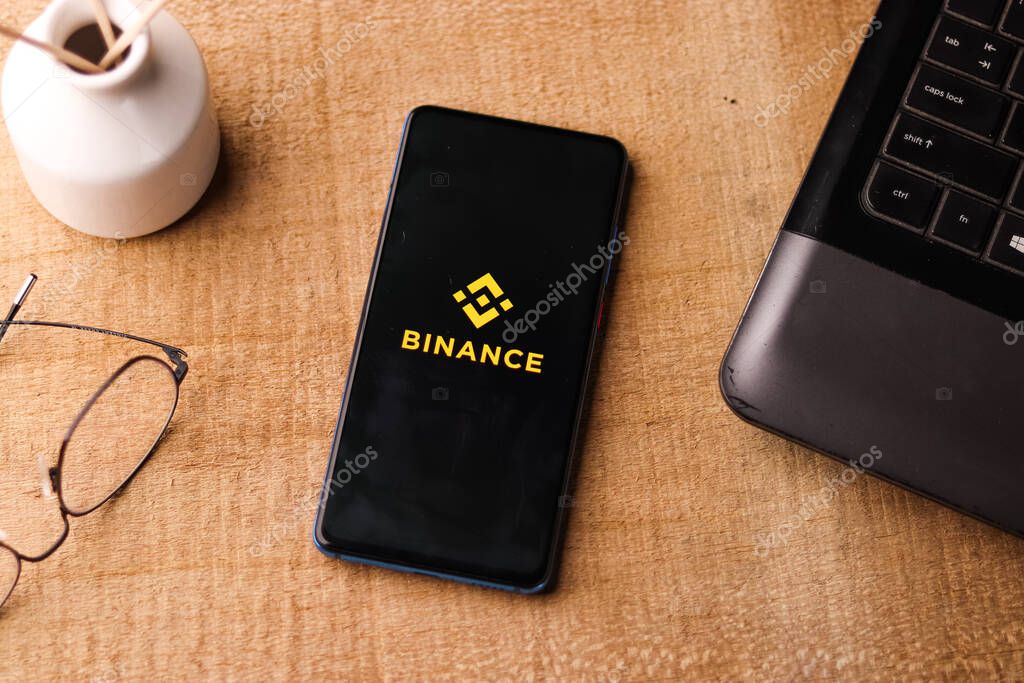 Assam, india - March 10, 2021 : Binance logo on phone screen stock image.