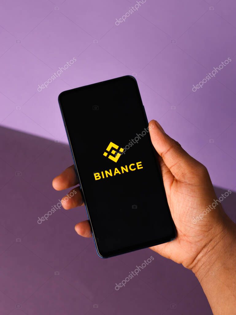 Assam, india - March 10, 2021 : Binance logo on phone screen stock image.
