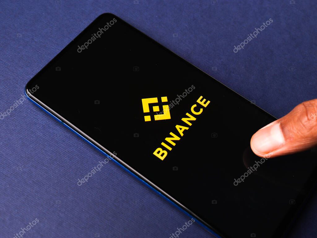 Assam, india - March 10, 2021 : Binance logo on phone screen stock image.