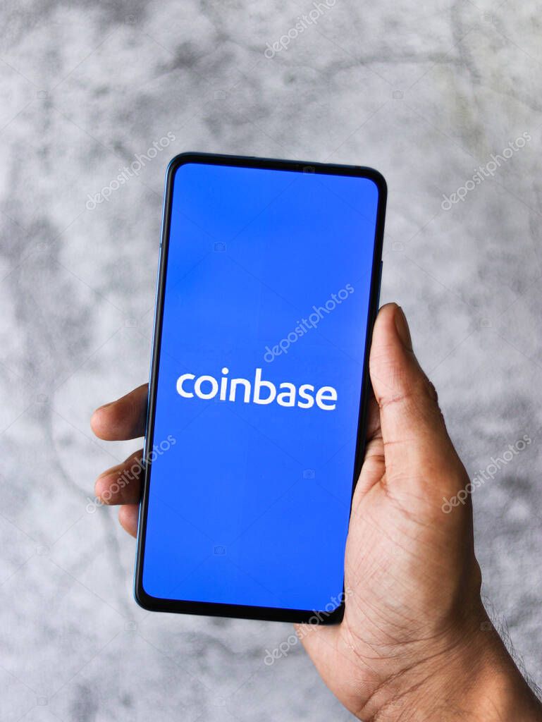 Assam, india - March 10, 2021 : Coinbase logo on phone screen stock image.