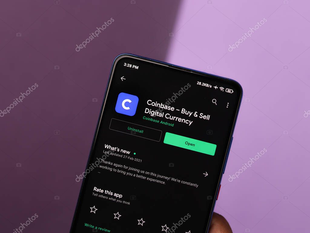 Assam, india - March 10, 2021 : Coinbase logo on phone screen stock image.