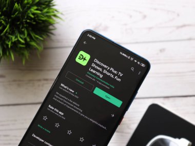 Assam, Hindistan - 10 Mart 2021: Discovery plus logo on phone screen stock image.