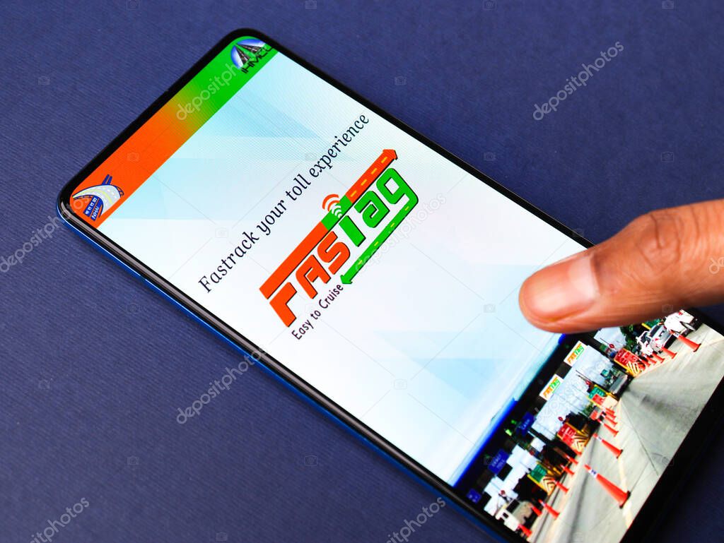 Assam, india - March 10, 2021 : FASTag logo on phone screen stock image.