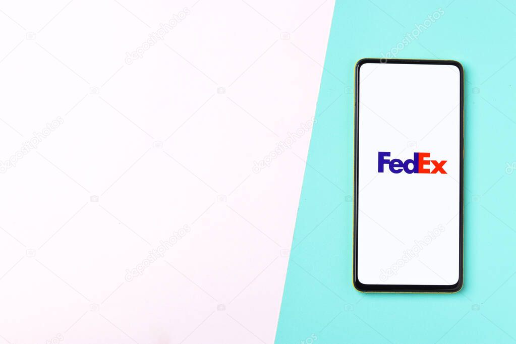 Assam, india - November 15, 2020 : Fedex logo on phone screen stock image.