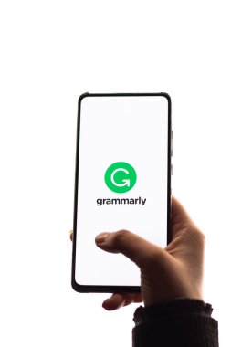 Assam, india - November 29, 2020 : Grammarly logo on phone screen stock image. clipart