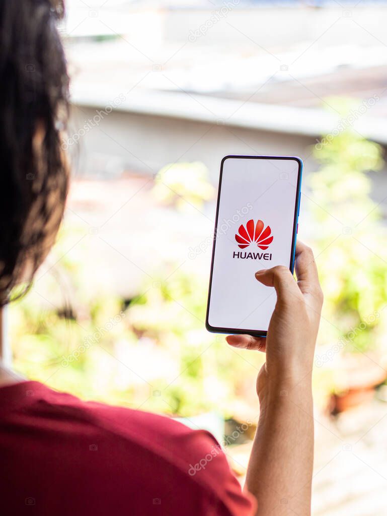 Huawei logo on phone screen stock image.