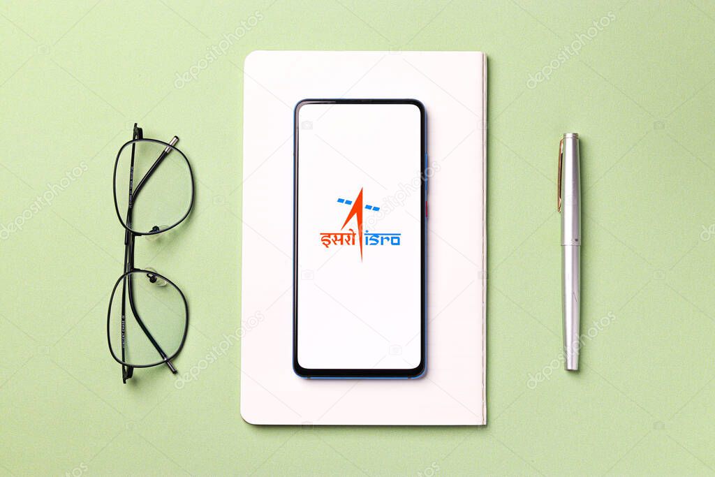 Assam, india - December 20, 2020 : Indian Space Research Organisation (ISRO) logo on phone screen stock image.