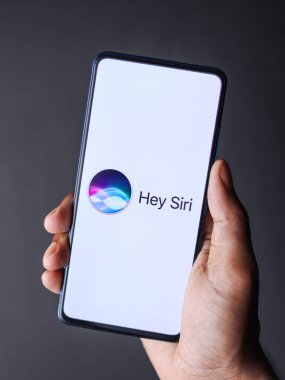 West Bangal, India - September 28, 2021 : Siri logo on phone screen stock image. clipart