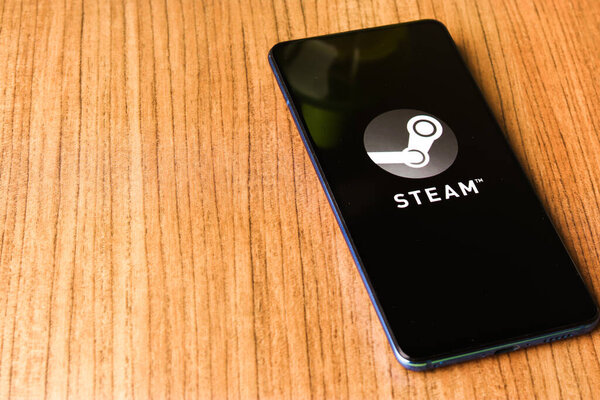 Assam, india - April 10, 2021 : Steam logo on phone screen stock image.