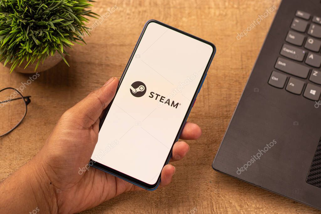 Assam, india - April 10, 2021 : Steam logo on phone screen stock image.