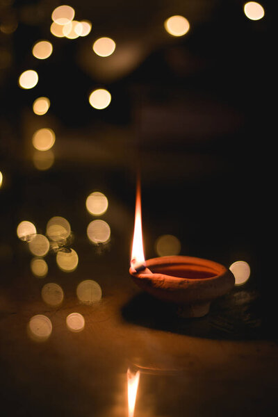 Clay Diya  or lamp with rangoli  stock image.