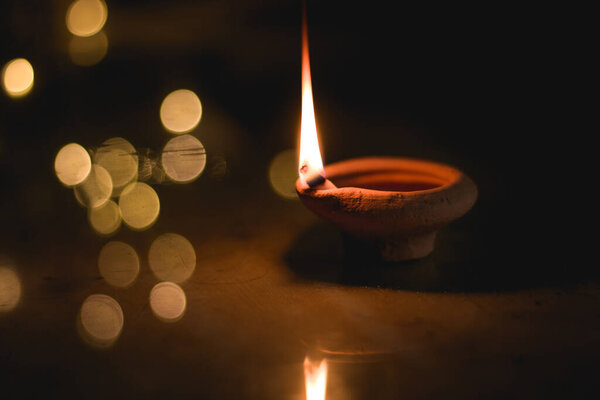 Clay Diya  or lamp with rangoli  stock image.