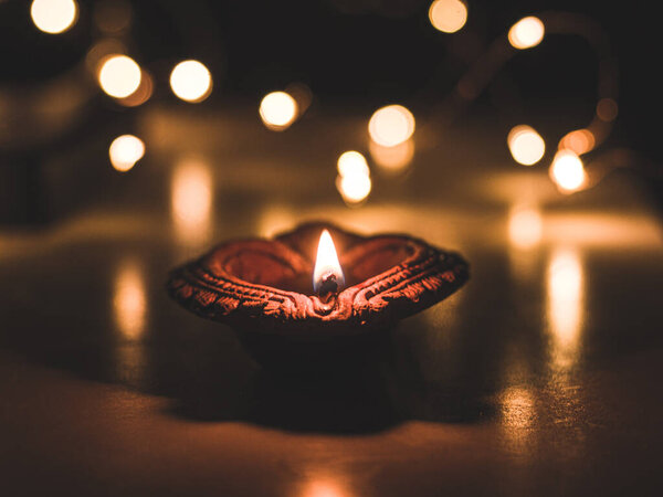 Clay Diya  or lamp with rangoli  stock image.