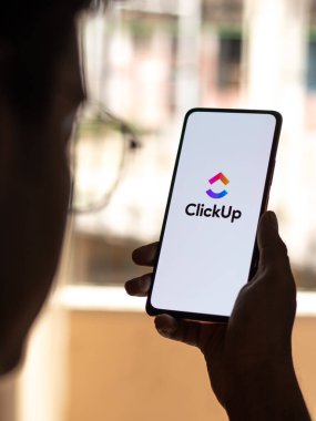 West Bangal, India - January 7, 2022 : ClickUp logo on phone screen stock image.