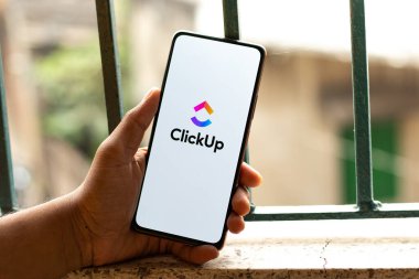 West Bangal, India - January 7, 2022 : ClickUp logo on phone screen stock image.