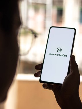West Bangal, India - December 15, 2021 : CoinMarketCap logo on phone screen stock image.
