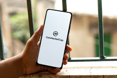 West Bangal, India - December 15, 2021 : CoinMarketCap logo on phone screen stock image.