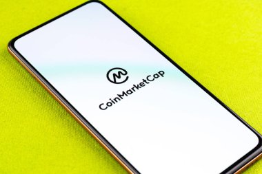 West Bangal, India - December 15, 2021 : CoinMarketCap logo on phone screen stock image.