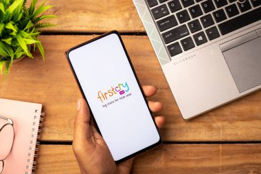 West Bangal, India - January 7, 2022 : FirstCry logo on phone screen stock image.