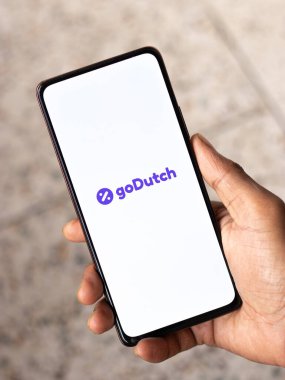 West Bangal, India - December 15, 2021 : goDutch logo on phone screen stock image.