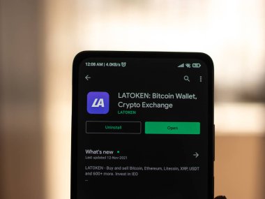 West Bangal, India - December 15, 2021 : LATOKEN logo on phone screen stock image.