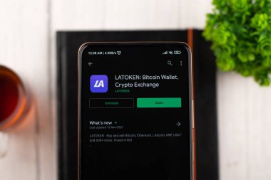 West Bangal, India - December 15, 2021 : LATOKEN logo on phone screen stock image.