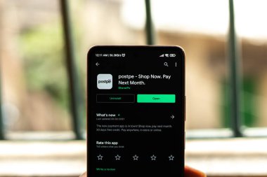 West Bangal, India - January 7, 2022 : Postpe logo on phone screen stock image.