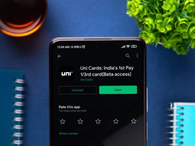 West Bangal, India - December 15, 2021 : Uni cards logo on phone screen stock image.