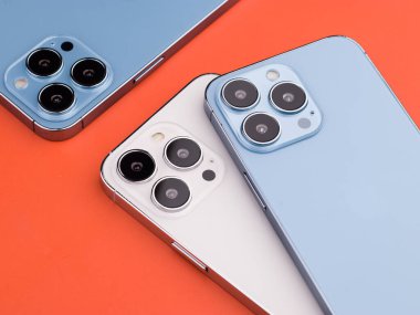 West Bangal, India - January 10, 2022 : Apple iphone 13 pro in frame with colorful background.