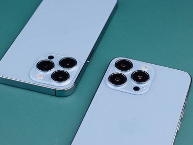 West Bangal, India - January 10, 2022 : Apple iphone 13 pro in frame with colorful background.