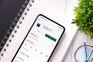 West Bangal, India - December 05, 2021 : Amazon A to Z logo on phone screen stock image.