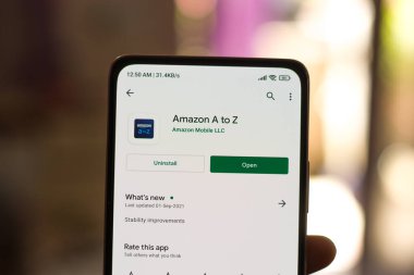 West Bangal, India - December 05, 2021 : Amazon A to Z logo on phone screen stock image.