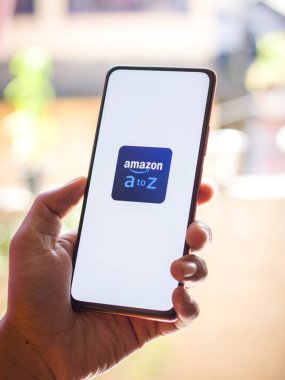 West Bangal, India - December 05, 2021 : Amazon A to Z logo on phone screen stock image.